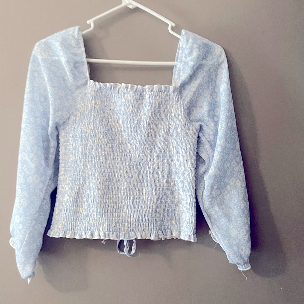 Blue floral top that has a string to tie it shorter